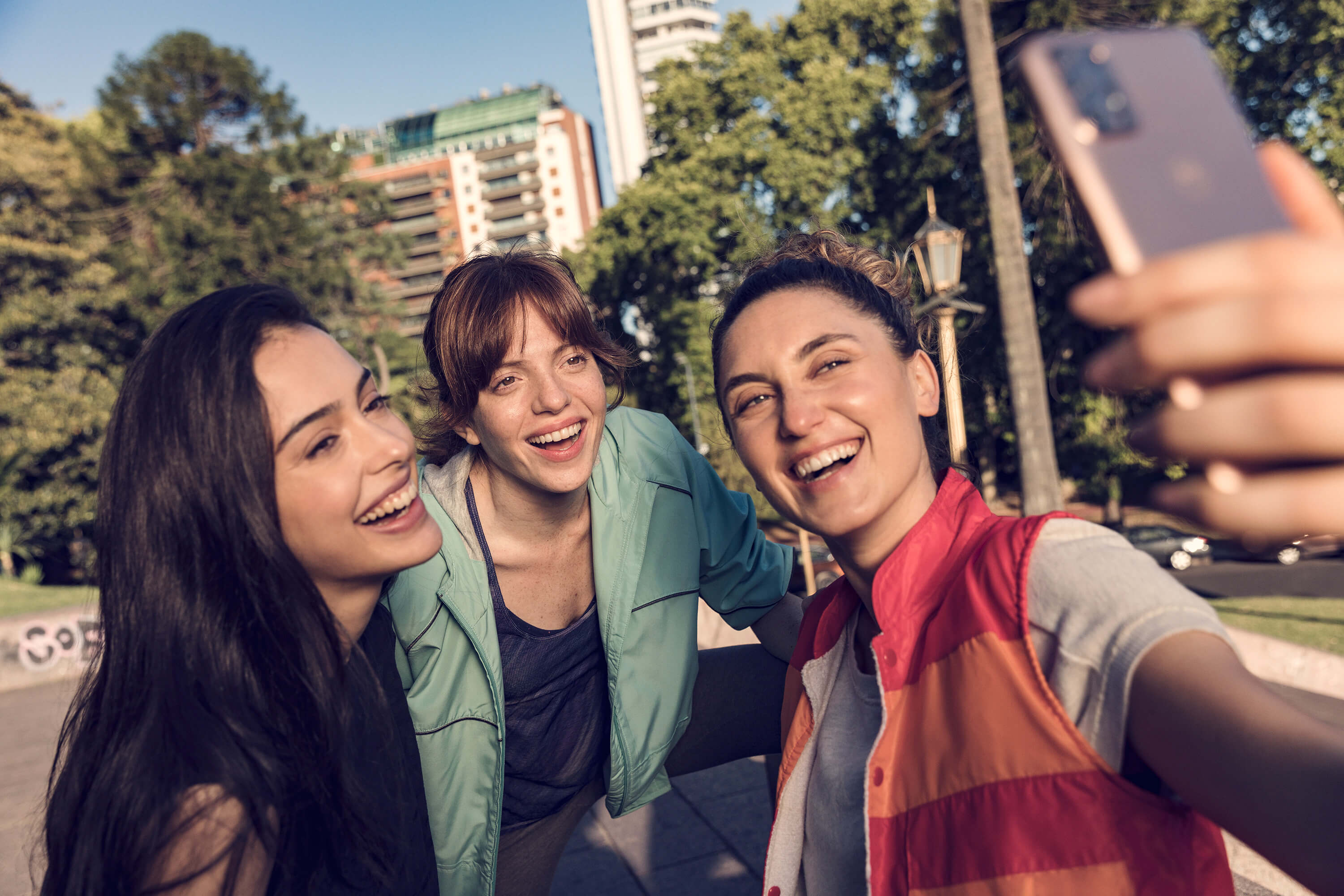 A group of women taking a selfie in the park